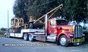 Mike McWilliams brought his Kenworth tractor and lowboy trailer to help transport vehicles and equipment.<br>The weather was turning nasty and it was getting dark that evening, sorry for the poor quality of photo