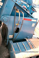 This lowboy is preparing for the detachment of the gooseneck, as the lowboy bed is lying on the ground.<br>
				  Notice the 2 locking pins, where the gooseneck keeps locked into the lowboy bed