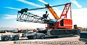 Crawler crane is on top of steel ramps now, so that the crane chassis is above the deck height<br>
				  of the lowboy trailer