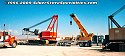 The truck tractor is backed up so that the gooseneck can be re-attached, and the lowboy bed unit<br>
				  is then raised via hydraulics until the bed unit contacts the bottom of the crane chassis