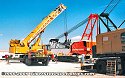 Once the crane chassis is resting on the lowboy bed unit, the crawler tread units can be removed<br>
				  from each side and will be loaded on separate flatbed trailers later