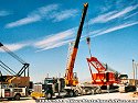 Once the crawler tread units are removed, the crane boom & counterbooms are lowered into travelling position,<br>
				  and the crane is secured to the lowboy bed unit