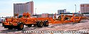 These heavy-haul lowboy trailers were set aside after unloading construction equipment