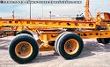 These heavy-haul lowboy trailers were set aside after unloading construction equipment