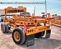 These heavy-haul lowboy trailers were set aside after unloading construction equipment