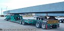 Left side of lowboy, looking forward. Note the significant amount of chains and bindings used