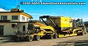 One of Jake's cranes being returned to their yard, hauled by a Peterbilt heavy-haul tractor and lowboy combination