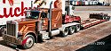 Peterbilt with Triple Rear Axles and Lowboy Trailer, at a Las Vegas area truck stop around 1996